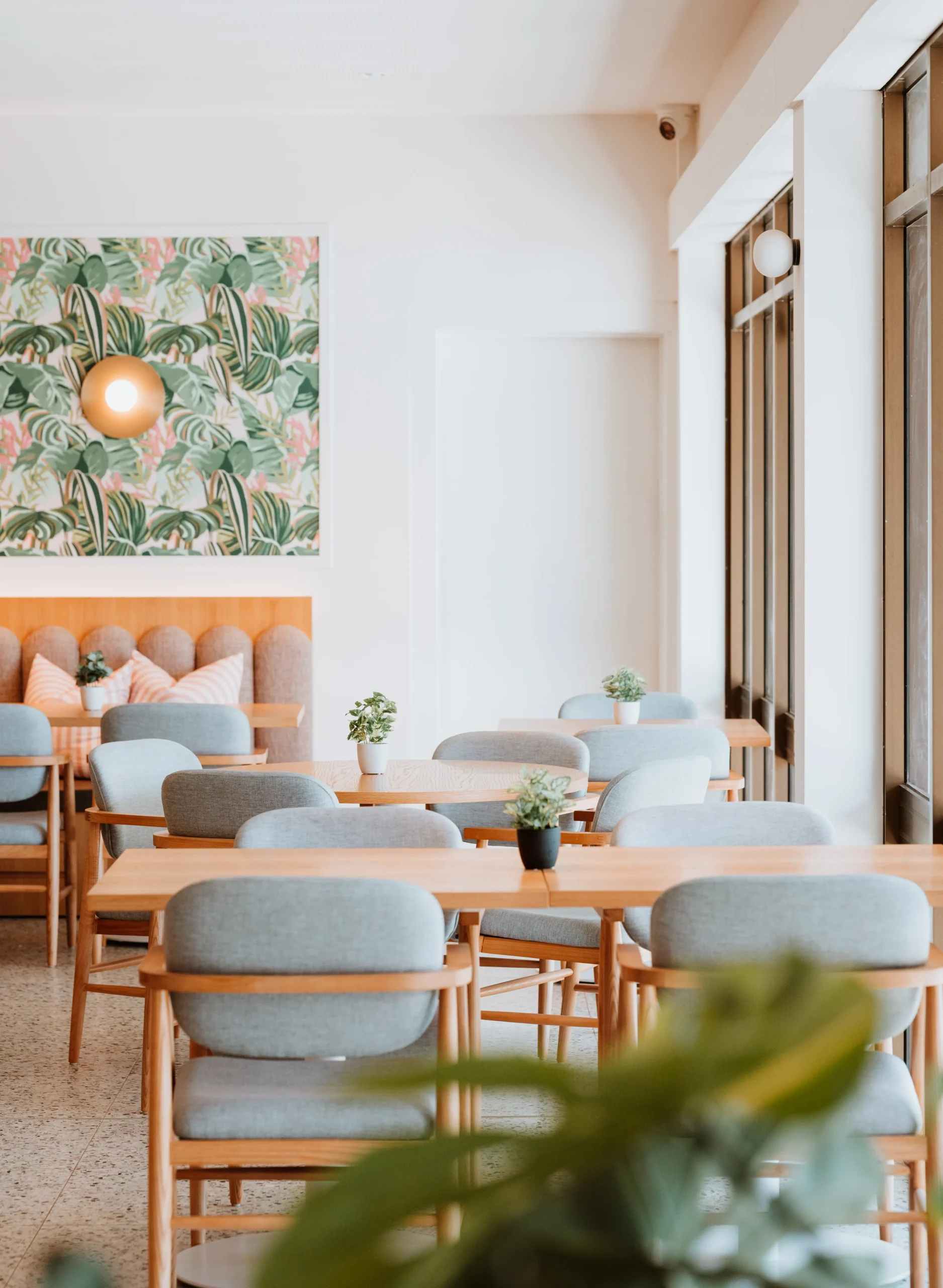 Interior dining at the Hedland Hotel with light and tropical decor