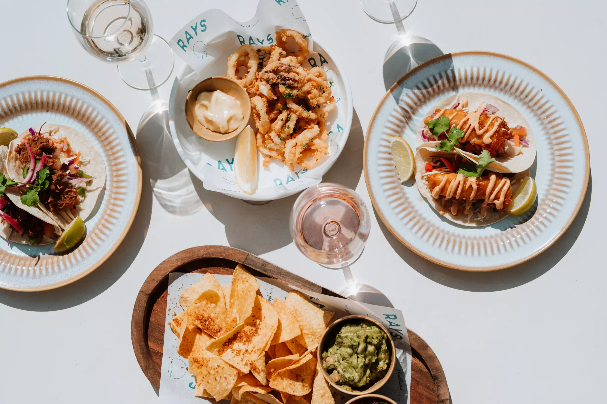 selection of dishes from Rays with wine in the sunshine