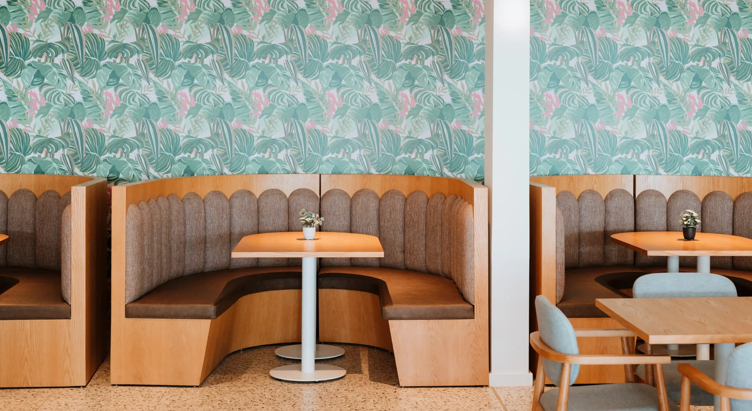 Booth seating for interior dining at the hedland hotel the brown of the booths is contrasted against tropical wallpaper
